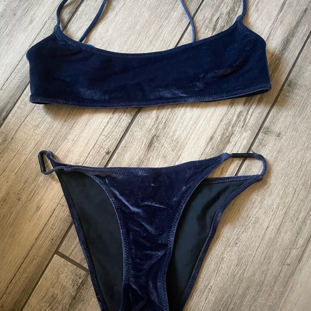 A Triangl two piece swimsuit in this deep color blue